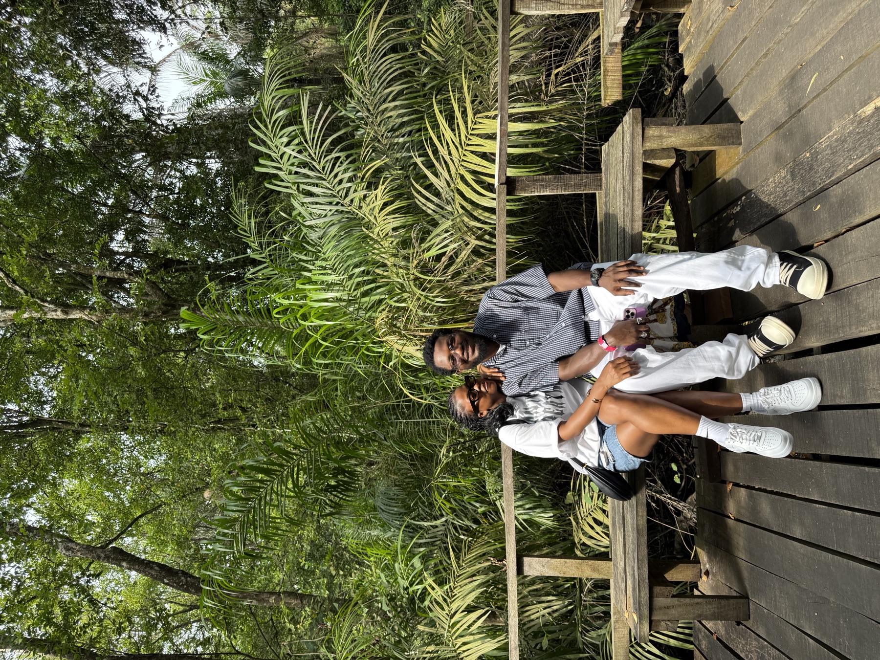 Doose and Deri sitting together in a garden setting